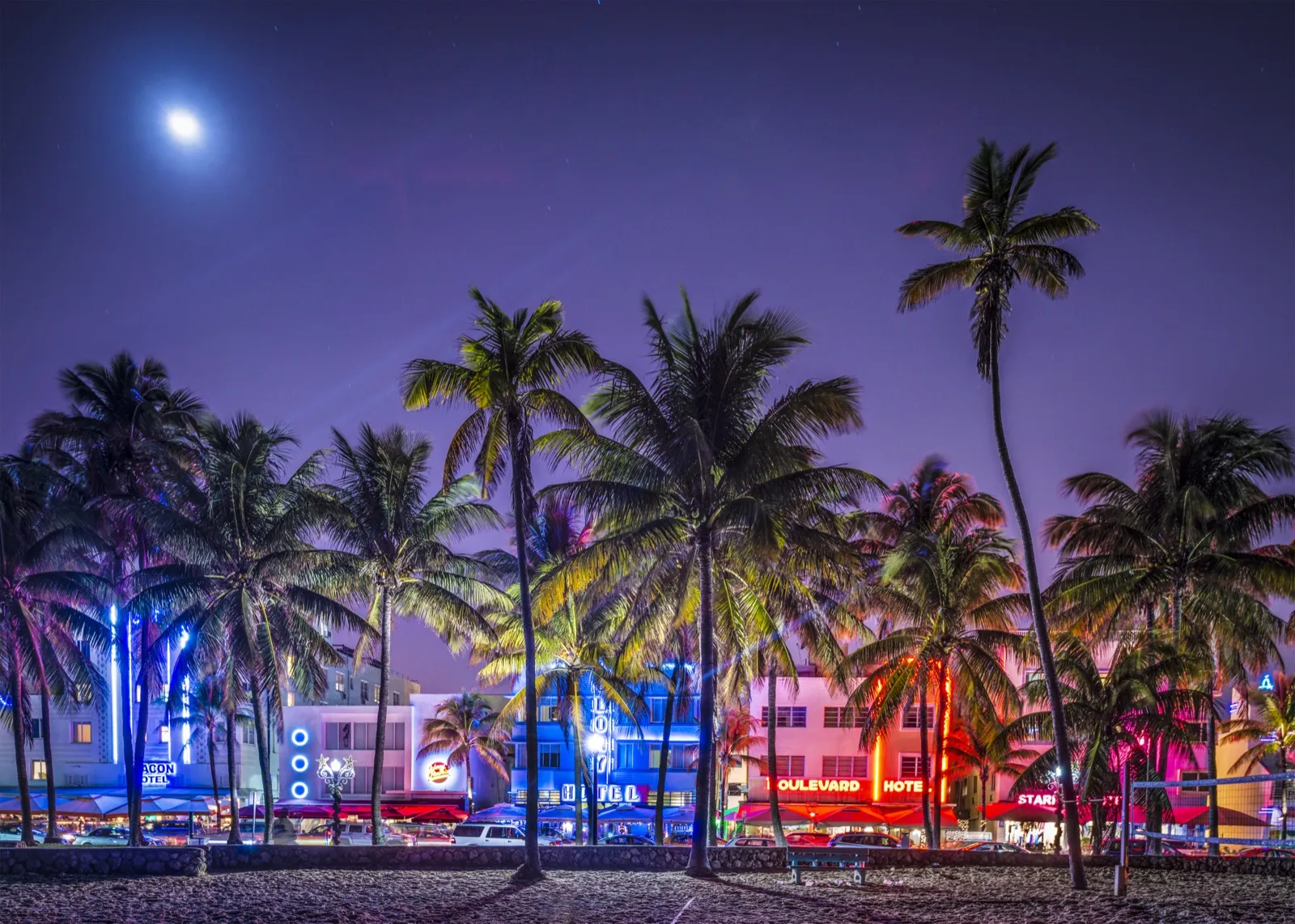 South Beach Art Deco district at night, capturing the vibrant energy near Rewind Anti-Aging clinic